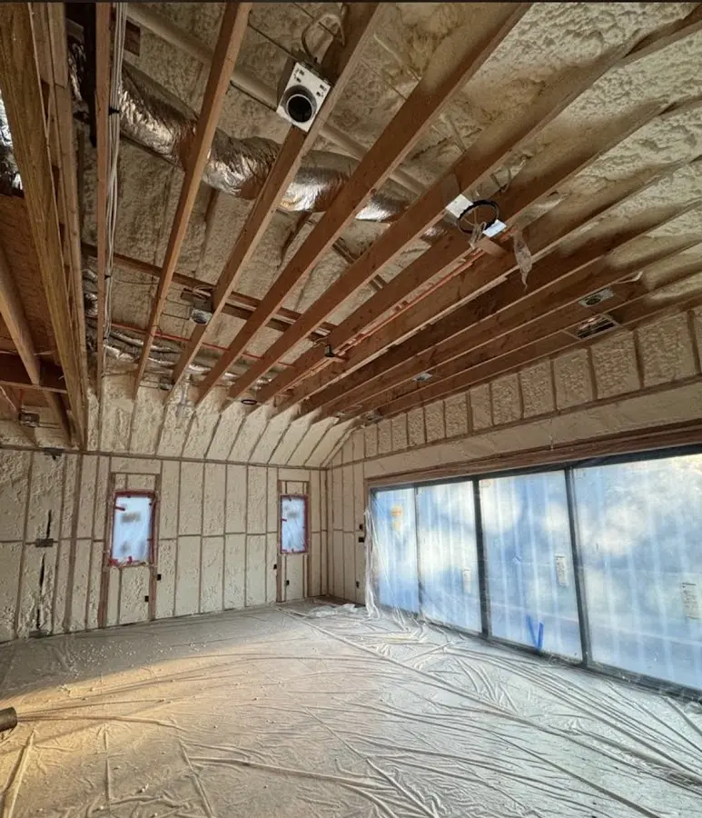 Interior walls and ceiling insulated with spray foam during new construction in Fayetteville